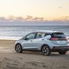 Rear side view of 2022 Chevrolet Bolt EV parked on beach