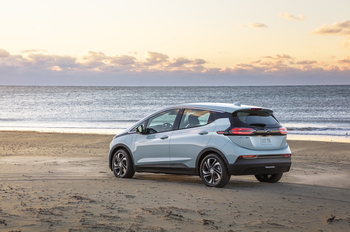 Rear side view of 2022 Chevrolet Bolt EV parked on beach