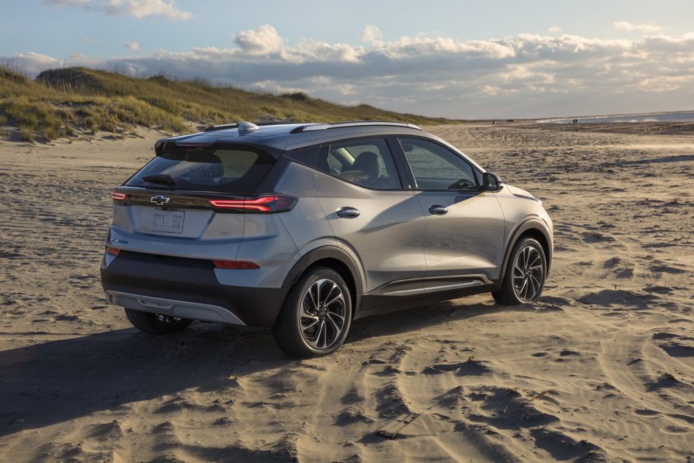 Rear side view of 2022 Chevrolet Bolt EUV on beach