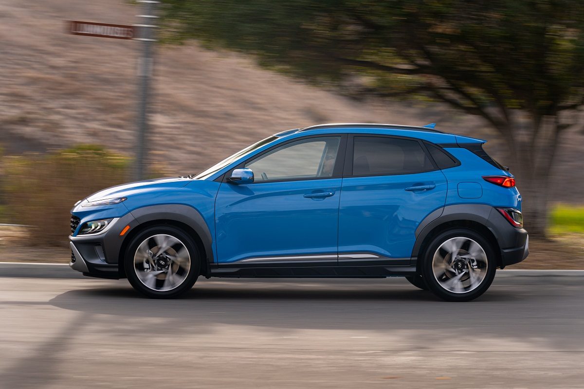 Side view of 2022 Hyundai Kona driving down road