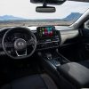 Interior shot of the front row of the 2022 Nissan Pathfinder showing steering wheel and center console