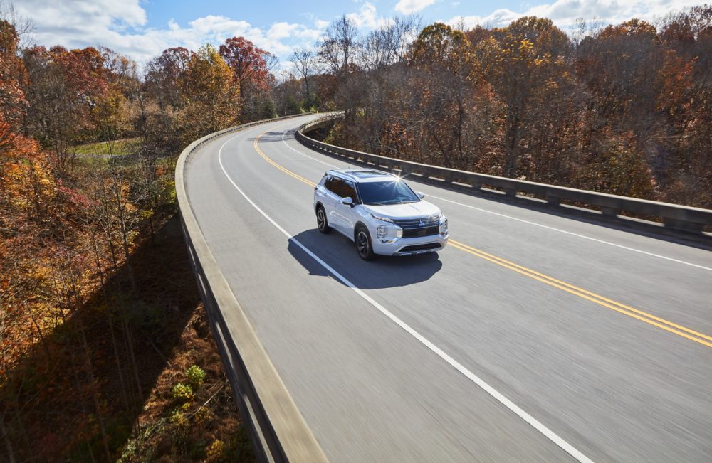 The 2022 Mitsubishi Outlander driving on the street