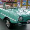 A front view of a teal Amphicar, the only mass-produced amphibious vehicle ever made