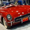 A bright red 1954 Chevrolet Corvette.