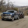 Front side view of Chevrolet Silverado 1500 towing a trailer