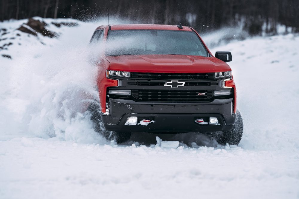 Front view of Chevrolet Silverado 1500 Trail Boss driving in snow