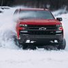 Front view of Chevrolet Silverado 1500 Trail Boss driving in snow