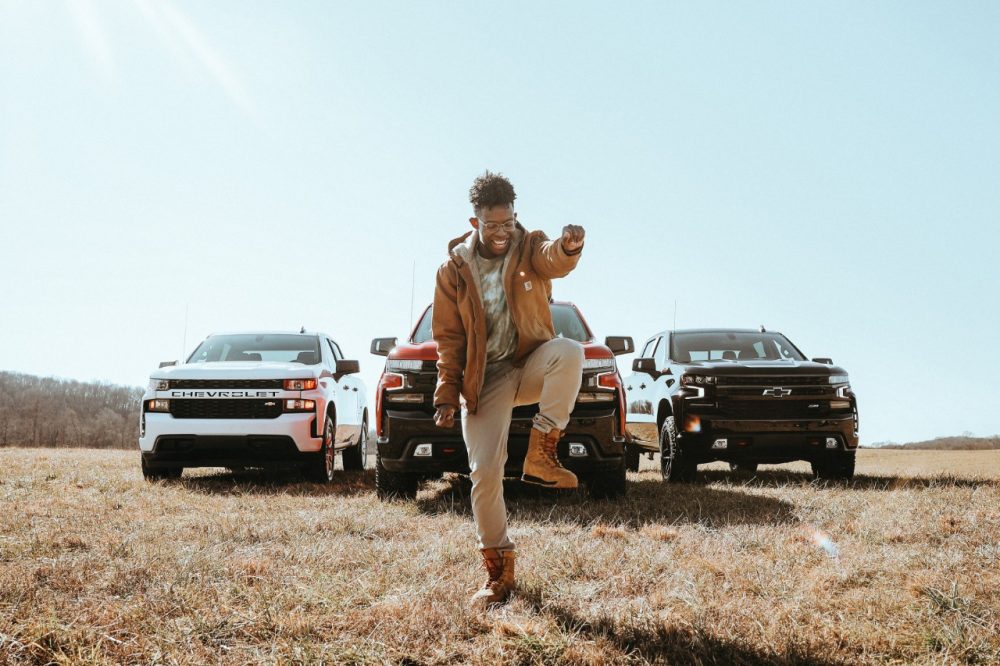 BRELAND dancing in front of three Chevrolet Silverado trucks in the rebooted “My Truck” music video