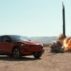 Mustang Mach-E v. Rocket Science - Mustang Mach-E sits next to a rocket launching in the desert