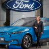 Ford of Canada CEO Bev Goodman with Grabber Blue Ford Mustang Mach-E