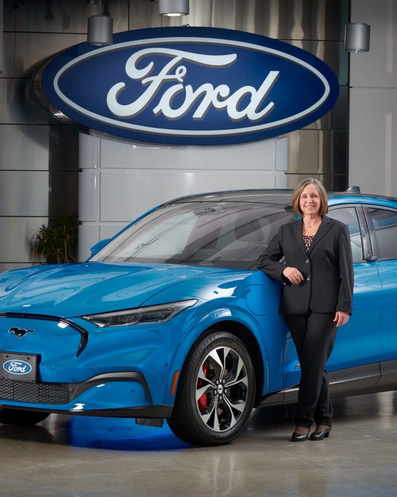 Ford of Canada CEO Bev Goodman with Grabber Blue Ford Mustang Mach-E