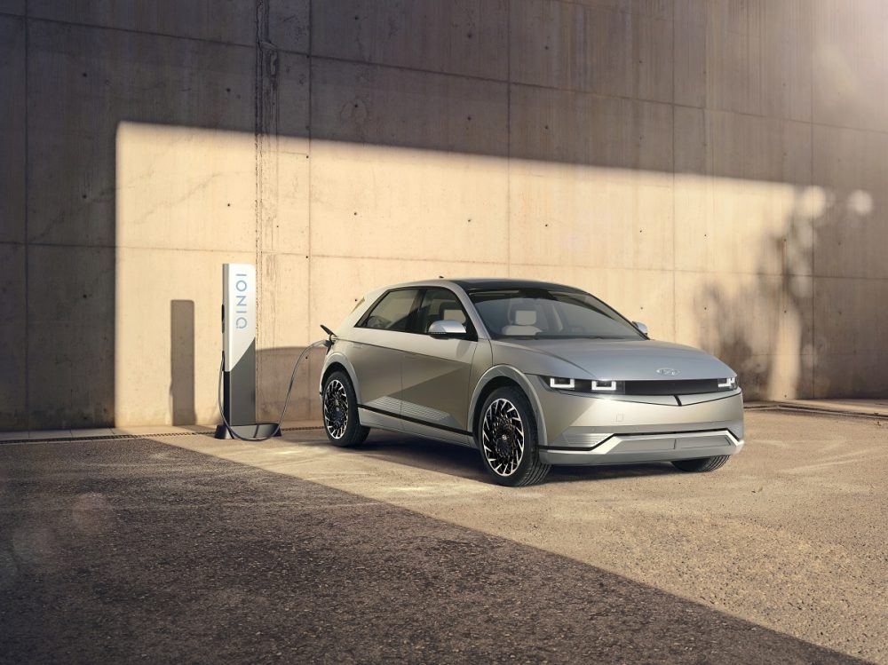 Front side view of 2022 Hyundai Ioniq 5 hooked up to charger