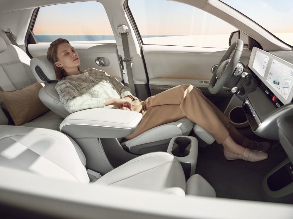 Woman reclining in driver's seat of 2022 Hyundai Ioniq 5