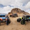 Jason Scherer, Loren Healy, and Vaughn Gittin Jr. with their Bronco ULTRA4 4400 racing trucks