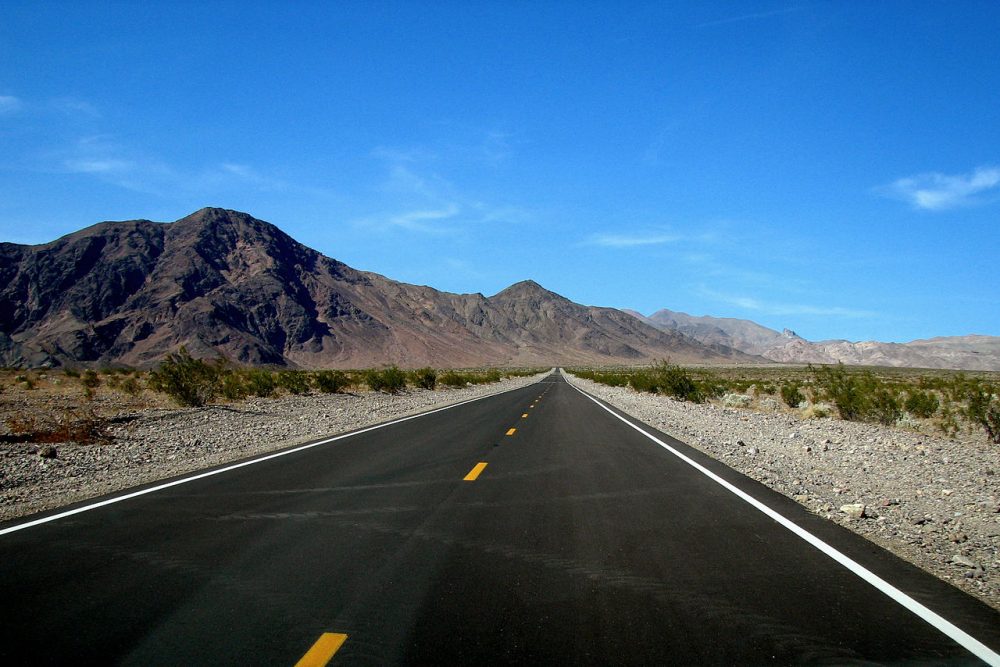 The open road under a blue sky