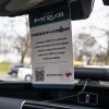 Toyota Mirai info card hanging from rearview mirror