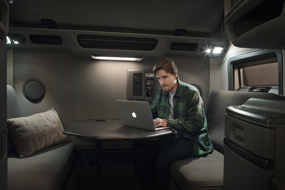 Volvo Trucks customer on a laptop, presumably checking out the digital integrated insurance pilot