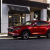 2021 Mazda CX-5 in front of a city storefront