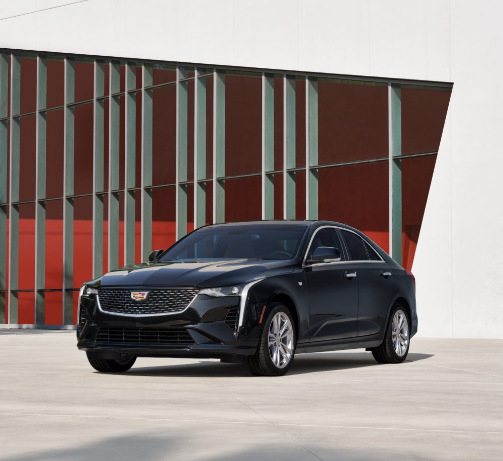 2021 Cadillac CT4 in front of a red and white geometric backdrop