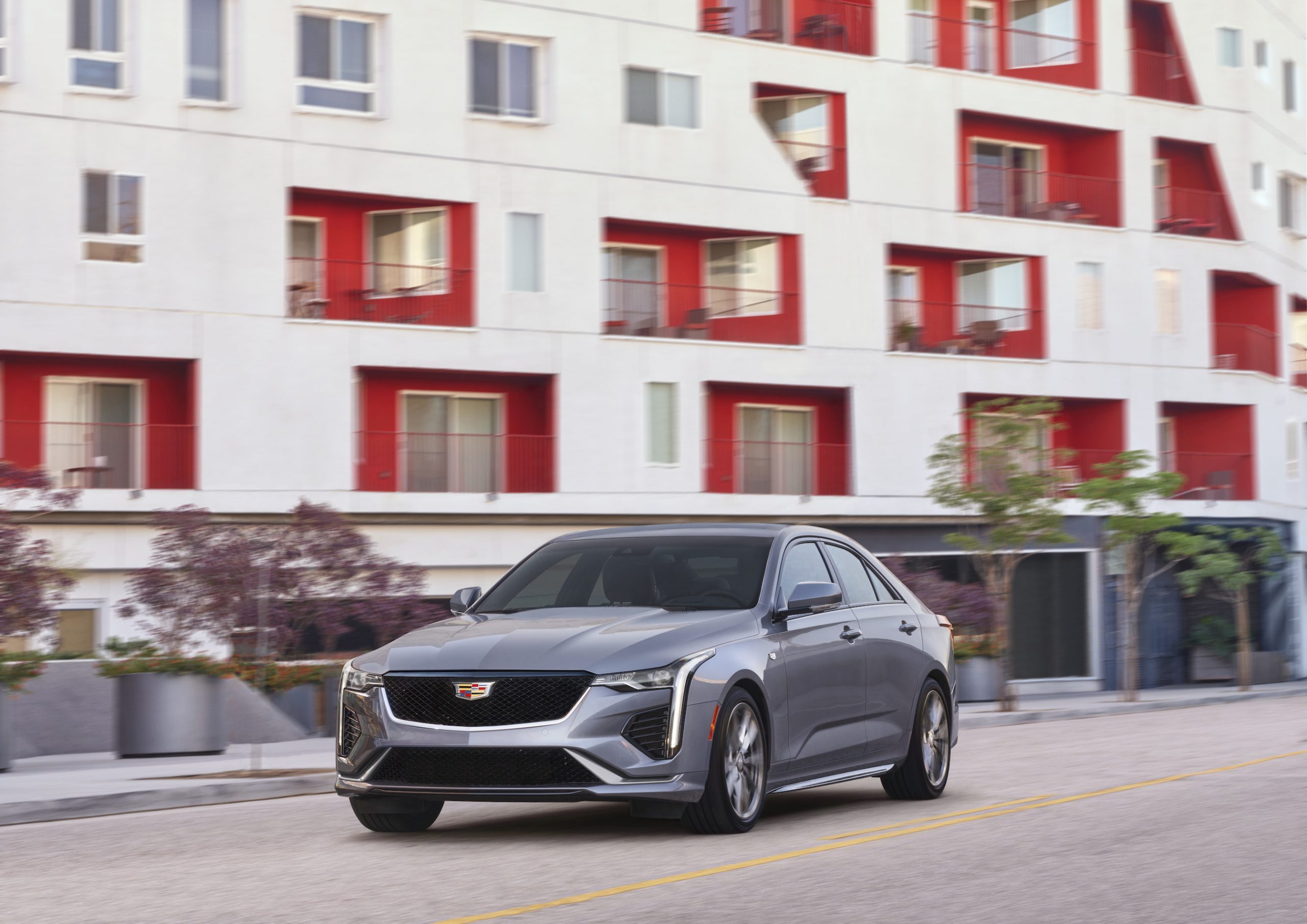 2021 Cadillac CT4 in front of a red and white building