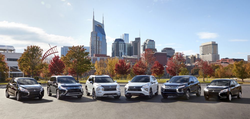 The 2021 Mitsubishi lineup in front of a city