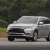 The 2021 Mitsubishi Outlander PHEV driving on the street