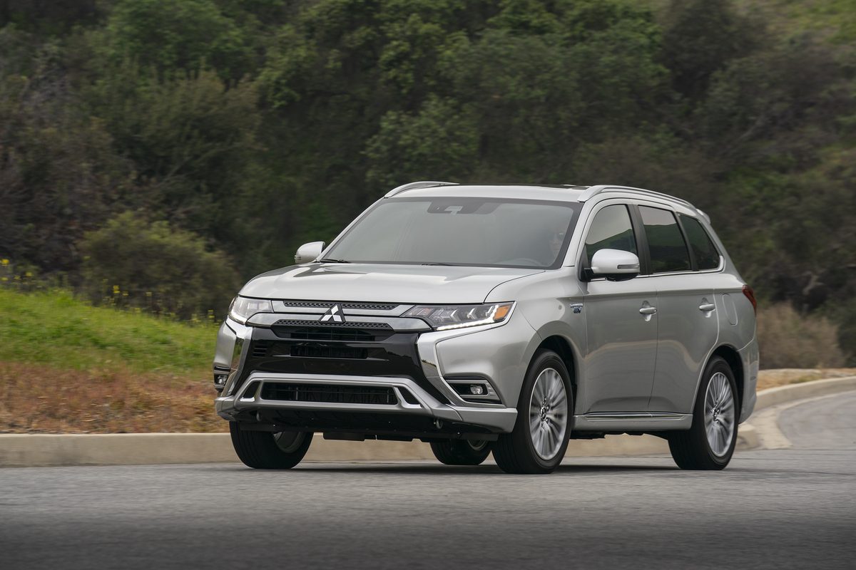 The 2021 Mitsubishi Outlander PHEV driving on the street