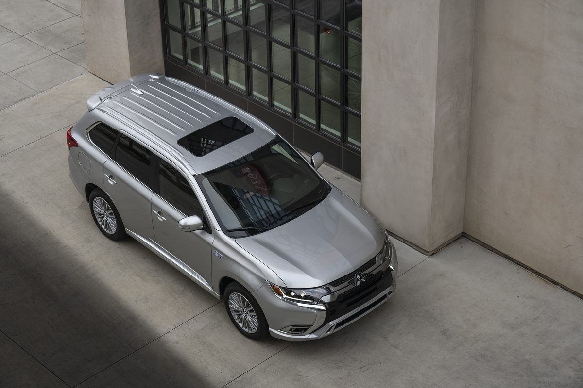 The 2021 Mitsubishi Outlander PHEV parked by a building