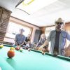 Bottle Rockets band members posed behind pool table