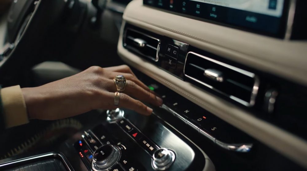 Jon Batiste pretends to play the piano key shifter in the new 2021 Lincoln Nautilus in a new commercial