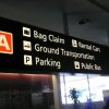 Airport sign directing passengers to the rental car desks