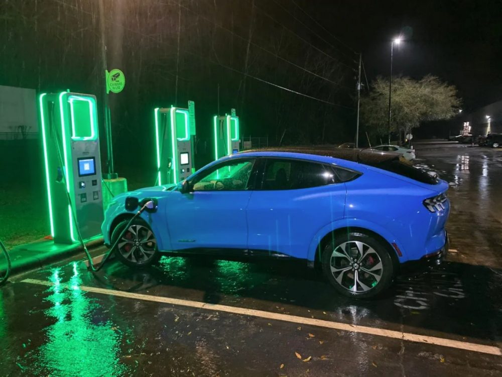 Sergio Rodriguez's Grabber Blue Ford Mustang Mach-E fueling up at a charging station | Mustang Mach-E takes cross-country trip