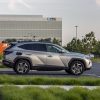 Side view of 2022 Hyundai Tucson PHEV at charging station