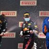 Verstappen, Hamilton, and Norris spray Ferrari Trento