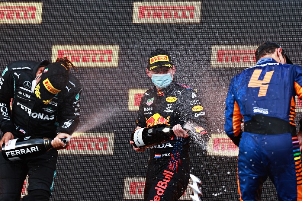 Verstappen, Hamilton, and Norris spray Ferrari Trento