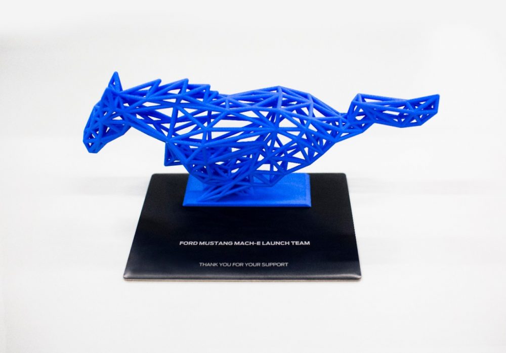 A pony sculpture in Grabber Blue Metallic that comes with the Mustang Mach-E First Edition 