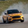 2021 Ford Mustang Mach-E GT in Cyber Orange with smoking tires