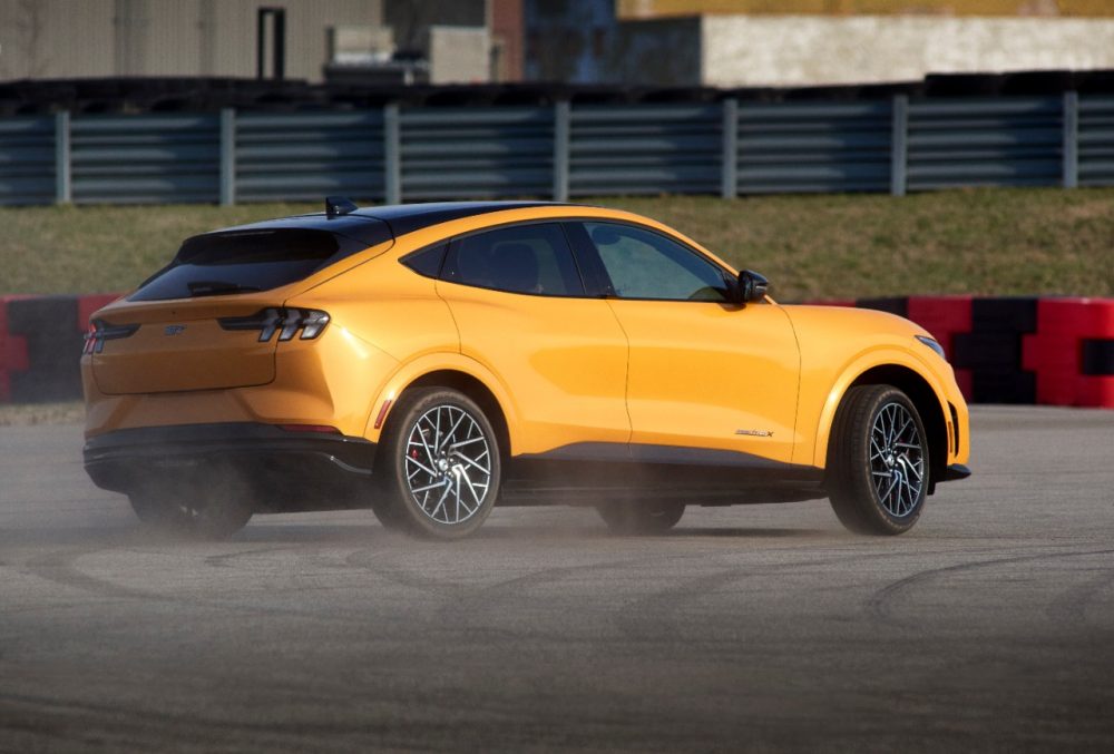 2021 Ford Mustang Mach-E GT in Cyber Orange smoking tires rear