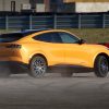 2021 Ford Mustang Mach-E GT in Cyber Orange smoking tires rear