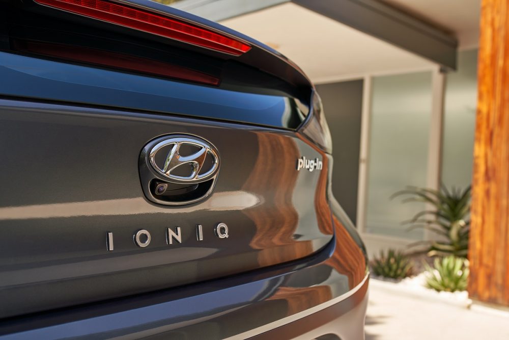 Close-up of Hyundai badge and Ioniq Plug-In Hybrid nameplate