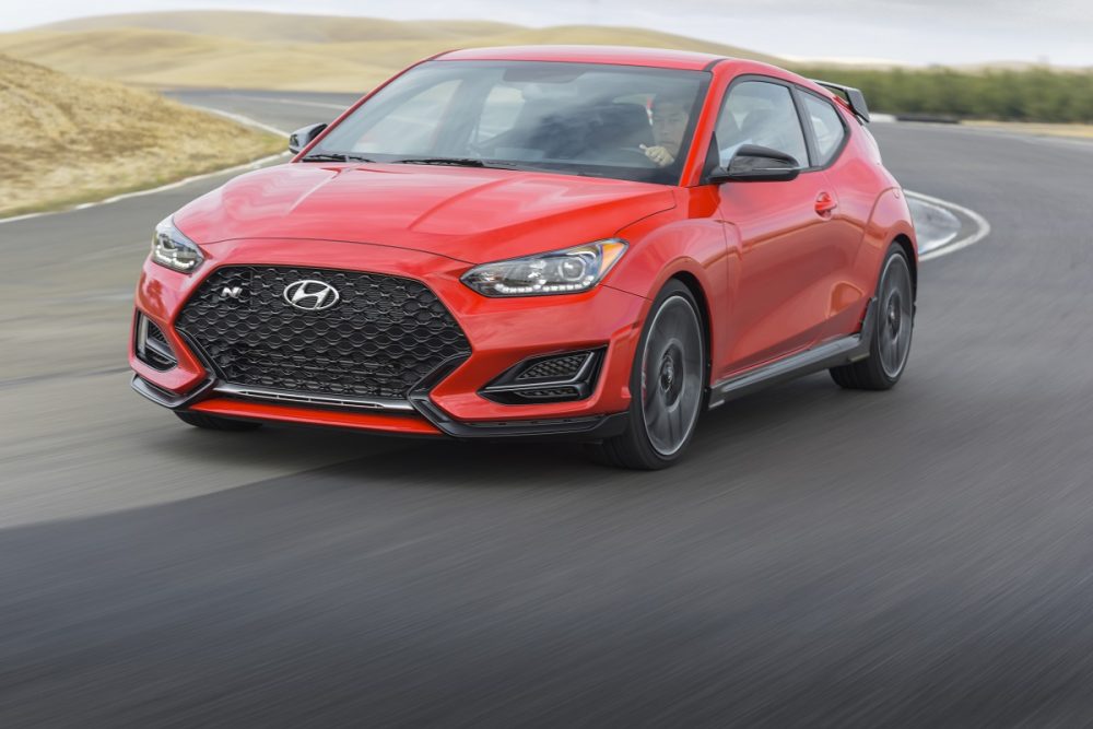 Front side view of 2021 Hyundai Veloster N driving around track