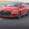 Front side view of 2021 Hyundai Veloster N driving around track