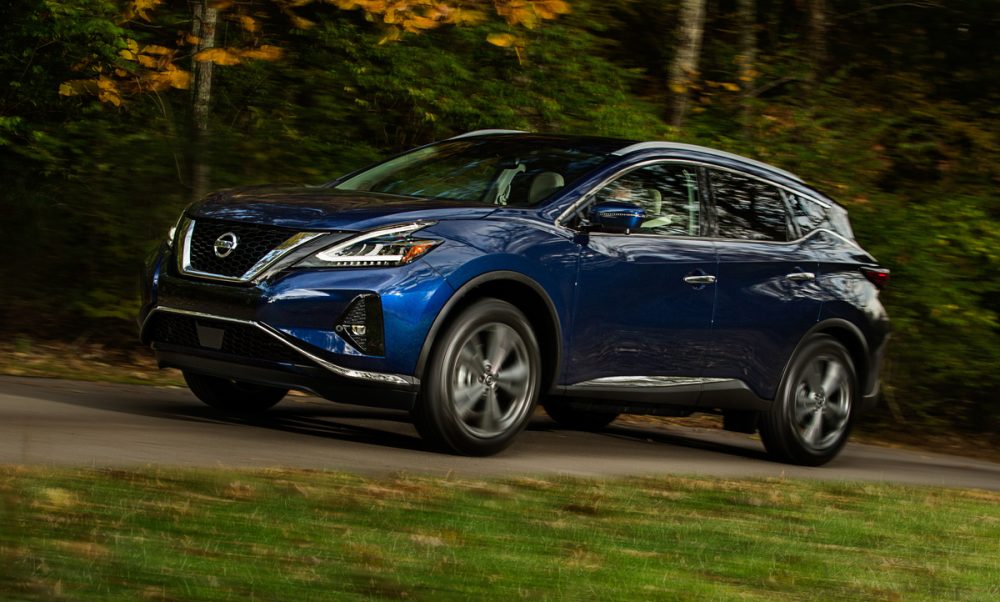 2021 Nissan Murano driving on a forested road