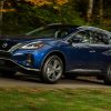 2021 Nissan Murano driving on a forested road