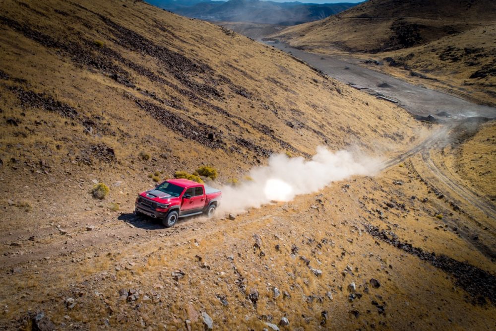 The 2021 Ram 1500 TRX driving on a mountain path