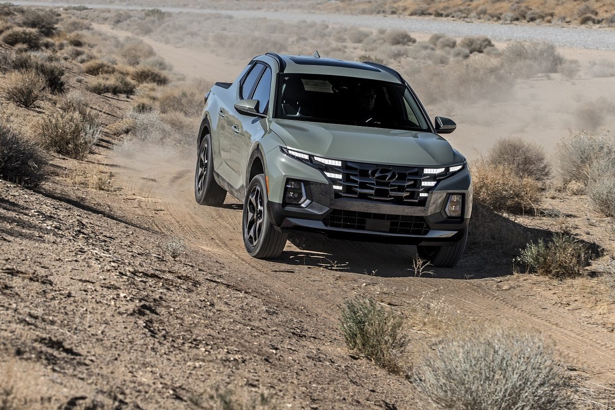 Front view of 2022 Hyundai Santa Cruz driving downhill on off-road trail