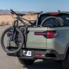 Rear side view of 2022 Hyundai Santa Cruz bed with bicycle hanging out