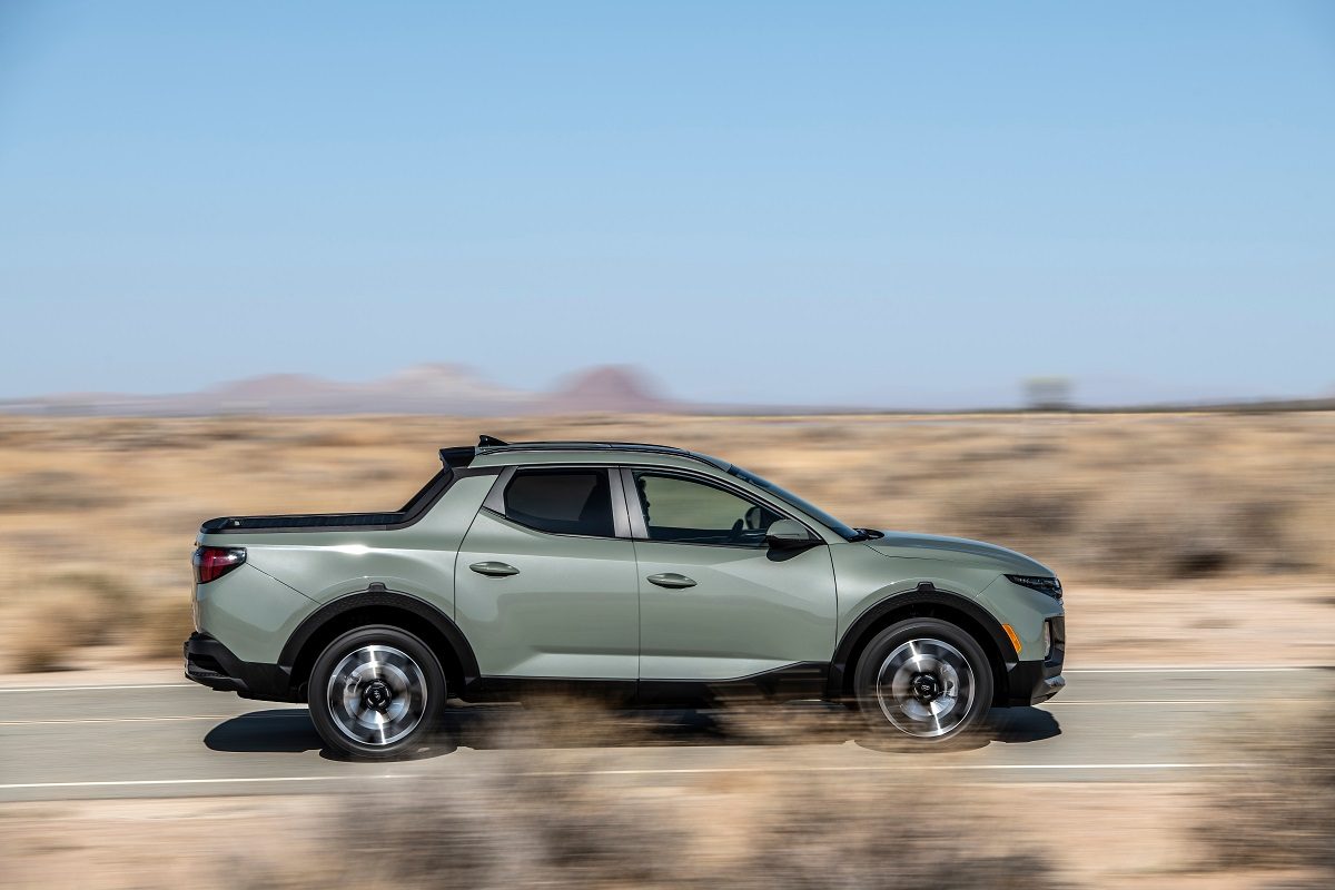 Side view of 2022 Hyundai Santa Cruz driving down road