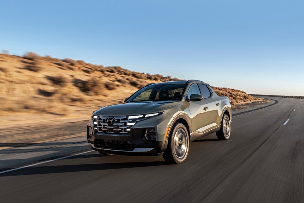 Front side view of 2022 Hyundai Santa Cruz driving down road