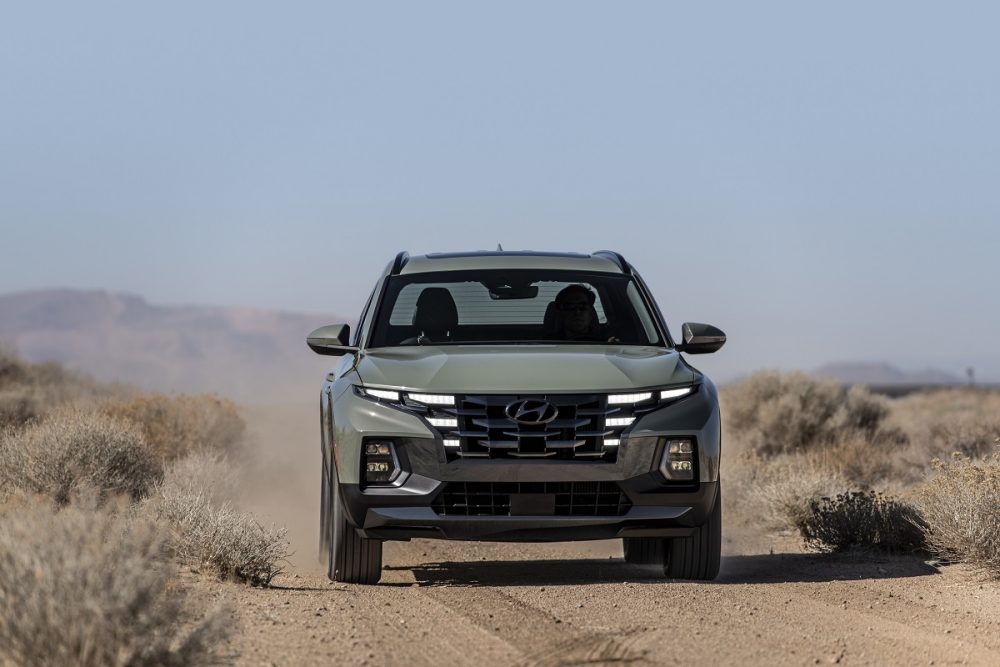 Front view of 2022 Hyundai Santa Cruz driving on off-road trail